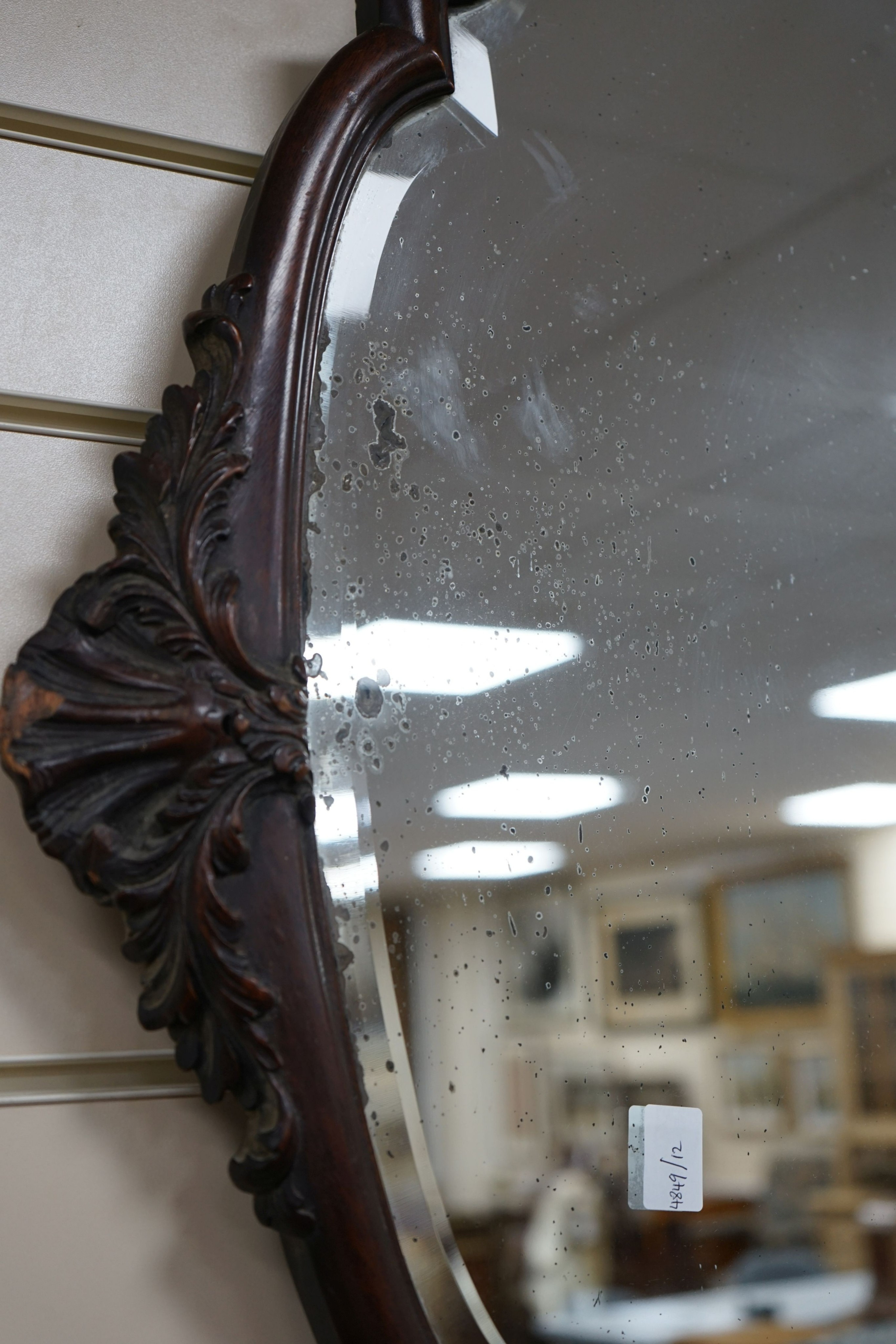 An early 20th century mahogany oval wall mirror, width 74cm, height 94cm